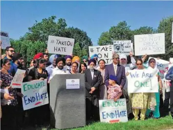  ?? AP ?? Speaking up Inderjit Singh Mukker speaks at a news conference in Darien, Illinois, saying because of his brown skin, turban and beard, he was beaten, on September 15.