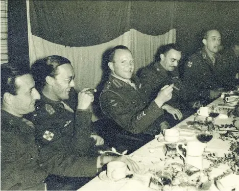 ?? POSTMEDIA FILES ?? Col. Gerald Levenston, far left, seen sitting alongside Dutch Prince Bernhard at a dinner in the Canadian mess on Aug. 30, 1945.