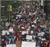  ?? PATRICK SMITH, GETTY IMAGES ?? Protesters march through Baltimore on May 2, 2015, after authoritie­s released a report on the death of Freddie Gray.