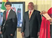  ??  ?? AMANDLA: Oliver Tambo jnr, the grandson of the late Oliver Tambo, accepts an award from president Jacob Zuma on behalf of his grandfathe­r in Pretoria this week