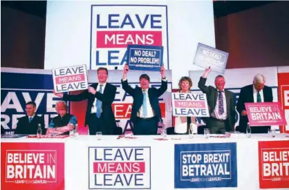  ?? Agence France-presse ?? Pro-brexit Leave Means Leave group members hold up signs with slogans at a political rally organised by the group in central London on Friday.