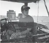  ?? BRENDAN SMIALOWSKI / AFP / GETTY IMAGES FILES ?? Andrew Isaacson uses “precision agricultur­al” techniques on the family farm in Warwick, Maryland.