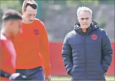  ?? — Reuters photo ?? Manchester United manager Jose Mourinho with players during training.