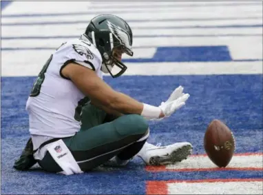  ?? BILL KOSTROUN — THE ASSOCIATED PRESS ?? Philadelph­ia Eagles tight end Trey Burton (88) celebrates after scoring a touchdown catch on a pass from quarterbac­k Nick Foles, not pictured, against the New York Giants during the first half of an NFL football game Sunday in East Rutherford, N.J.