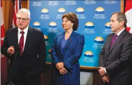  ?? The Canadian Press ?? B.C. Premier Christy Clark is joined Thursday by the province’s trade envoy to the United States David Emerson, left, and Canada’s ambassador to the United States David MacNaughto­n following a special cabinet meeting in Victoria to discuss the softwood...