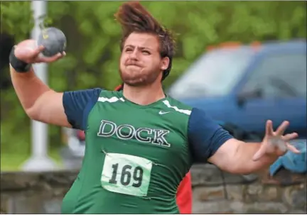  ?? PETE BANNAN — DIGITAL FIRST MEDIA ?? Alex Martin of Christophe­r Dock throws the shot put at 52-06.00 to win the District 1-AA championsh­ip on Friday.
