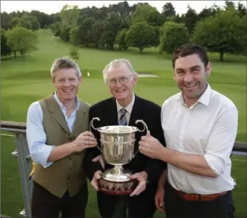  ??  ?? Fr John Daly and Barry Doyle from sponsor Arboretum present the Kilquade Cup to Seamus Fitzpatric­k who captained his team of Frank Smith, Tommy McMahon and Vincent Brady to victory on Saturday at Delgany Golf Club.