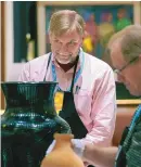  ?? EDDIE MOORE/JOURNAL ?? Eric Blinman, then-director of the New Mexico Office of Archaeolog­ical Studies, helped judge the best of class in pottery for the Santa Fe Indian Market in 2009. Blinman was recently fired from his job, where he had worked since 1988.