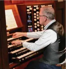  ?? Joanne Bouknight / Contribute­d photo ?? James O’Donnell, former organist and master of the choristers at Westminste­r Abbey, plays the organ at Christ Church in Greenwich.