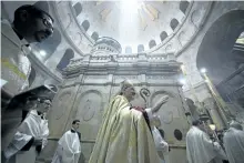  ?? SEBASTIAN SCHEINER/AP FILES ?? In this April 16, 2017 file photo, Latin Patriarch of Jerusalem Pierbattis­ta Pizzaballa, centre, walks with Christian clergymen on Easter Sunday at the Church of the Holy Sepulchre, in Jerusalem. In a joint statement, the leaders of the major Christian...