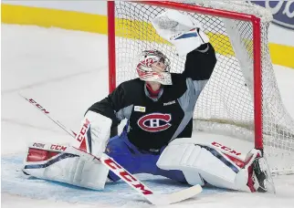  ?? ALLEN McINNIS ?? Montreal Canadiens goalie Carey Price makes a save during his first full practice with his teammates on Wednesday at the Bell Centre after sitting out a week with the flu.