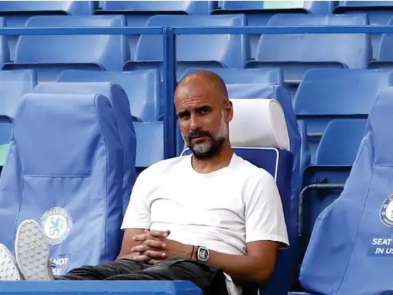  ??  ?? Man City coach Pep Guardiola looks on from the sidelines (Getty)