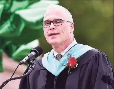  ?? Catherine Avalone / Hearst Connecticu­t Media ?? Paul Freeman, superinten­dent of schools in Guilford, speaks at the Guilford High School commenceme­nt on the Guilford Town Green on June 22, 2018.