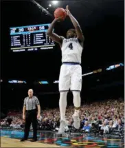  ?? DAVID J. PHILLIP — THE ASSOCIATED PRESS ?? Villanova forward Eric Paschall shoots a 3-point basket during the second half against Kansas in the semifinals of the Final Four NCAA college basketball tournament Saturday in San Antonio.