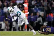  ?? ASSOCIATED PRESS ?? IN THIS OCT. 26 FILE PHOTO, Miami Dolphins running back Jay Ajayi breaks free from Baltimore Ravens free safety Lardarius Webb in the first half of an NFL football game, in Baltimore. The NFL-leading Eagles have bolstered their offense by acquiring...