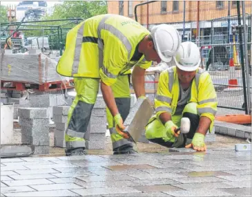  ?? Picture: Wayne McCabe FM2733636 ?? The first of the granite being laid by contractor­s in Lower High Street, Maidstone