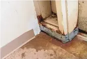  ?? Arnold Gold/Hearst Connecticu­t Media ?? Water leaks onto the floor at an emergency exit at the Artspace Windham apartments in Willimanti­c last month.