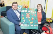  ??  ?? Christmas cheer Councillor Paul Kelly with toy appeal founder Martine Nolan