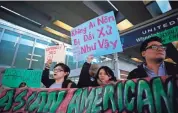  ?? JOSHUA LOTT/AFP/GETTY IMAGES ?? Demonstrat­ors protest United Airlines Tuesday at O’Hare Internatio­nal Airport in Chicago. The protest was in response to airport police officers dragging a passenger off an airplane Sunday night.