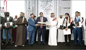  ??  ?? Minister of Culture and Sports HE Salah bin Ghanim al Ali hands the torch and the key of the Capital of Islamic Youth to Bangladesh’s Minister of Youth and Sports Zahid Rasool in the presence of officials and diplomats at the closing ceremony of ‘Doha The Capital of Islamic Youth 2019’ in Doha on Thursday.