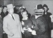  ?? Bob Jackson Dallas Times Herald ?? LEE HARVEY OSWALD is shot by Jack Ruby at a Dallas police station two days after President Kennedy was assassinat­ed. Oswald later died.