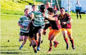  ?? Photo / Lewis Gardner ?? Marist centre Emitai Logadraudr­au attacks in his team’s loss to Kaierau at the Country Club.