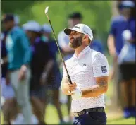  ?? Sam Greenwood / Getty Images ?? Dustin Johnson plays a shot on the ninth hole during a practice round prior to the start of the PGA Championsh­ip at Southern Hills Country Club on Wednesday in Tulsa, Okla.