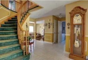  ?? ASHLEY AND ADAM MCFARLAND ?? THEN The early ’90s house in Cobourg that Ashley and Adam McFarland bought last year seemed frozen in time, with forest green carpet, gold colour palette and honey oak staircase.