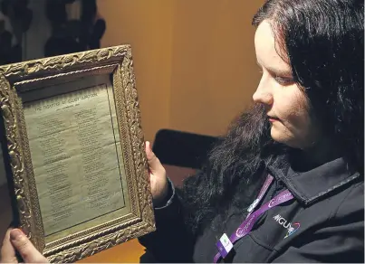  ?? Picture: Dougie Nicolson ?? Museum assistant Lucia Wallbank with one of the poems which were handed over to the Signal Tower Museum yesterday.