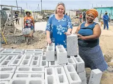  ?? Picture: WERNER HILLS ?? NEW AND BETTER: Eluvuyeni Pre-School owner Thandiswa Goniwe, right, and Walmer Angels founder Glenda Brunette with some of the building materials that have been sponsored by donors after fire destroyed the original creche