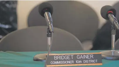  ?? | TIM BOYLE/ FOR THE SUN- TIMES ?? The chair for Cook County Commission­er Bridget Gainer is empty during the early part of a meeting of the Cook County Forest Preserve District in Palatine on Thursday. Gainer arrived 13 minutes before the meeting was adjourned.