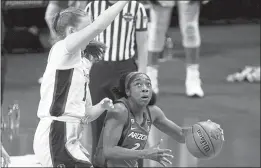  ?? PHOTOS BY MORRY GASH — THE ASSOCIATED PRESS ?? Arizona guard Aari McDonald (2) drives around Stanford forward Ashten Prechtel, left, during the first half of the championsh­ip game in the women’s Final Four NCAA college basketball tournament, Sunday at the Alamodome in San Antonio.