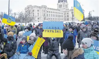  ?? KAYLE NEIS • POSTMEDIA NEWS ?? Protesters with the Stand With Ukraine movement who are against the current invasion of Ukraine by Russia rally outside the Saskatchew­an legislatur­e in Regina on March 3. Canadians have been showing their support for Ukraine, but what else can the government do?