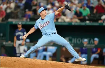  ?? AP Photo/LM Otero ?? ■ Texas Rangers relief pitcher Josh Sborz throws during the seventh inning against the Seattle Mariners on Sunday in Arlington, Texas. The Rangers won, 5-3.