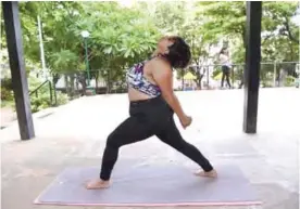  ??  ?? MUMBAI, Maharashtr­a: This photo show Dolly Singh, 34, doing yoga at a park in Mumbai. —AFP