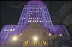  ?? BEN GRAY / BGRAY@AJC.COM ?? Atlanta City Hall was lit in purple in remembranc­e of Prince on Friday night. Similar tributes continued over the weekend in other locales.