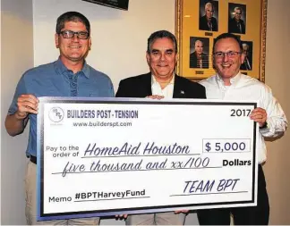  ??  ?? Presenting the donation are Greg Tomlinson (left) and Greg Madrey (righ), of Builders Post Tension, with Salty Thomason, president of HomeAid Houston.