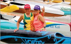  ?? ?? RIGHT: Taiwan Outrigger Canoe Voyaging Society founder Yvonne Jiann, left, at the Queen Lili’uokalani Canoe Race in Hawaii.