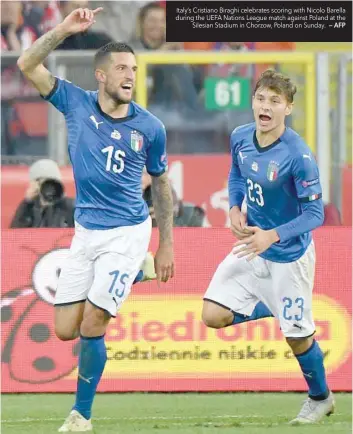  ?? — AFP ?? Italy’s Cristiano Biraghi celebrates scoring with Nicolo Barella during the UEFA Nations League match against Poland at the Silesian Stadium in Chorzow, Poland on Sunday.