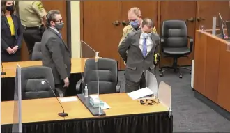  ?? COURT TV VIA AP, POOL ?? In this image from video, former Minneapoli­s police Officer Derek Chauvin is taken into custody as his attorney, Eric Nelson (left) looks on after the verdicts were read at Chauvin’s trial for the 2020 death of George Floyd, Tuesday at the Hennepin County Courthouse in Minneapoli­s.