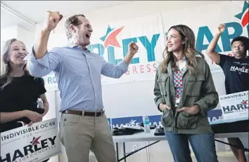  ?? Mario Tama Getty Images ?? HARLEY ROUDA, second from left, campaigns Saturday in Costa Mesa with actress Jessica Alba. He was a registered Republican in the 1980s and ’90s before becoming an independen­t and, last year, a Democrat.