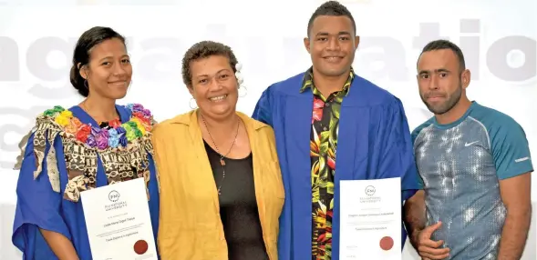  ?? Photo: Fiji National University ?? Fiji National University graduates Loata Tabua (left), and Clapton Underwood (third from left), with family members.