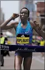  ?? AP/ELISE AMENDOLA ?? Edna Kiplagat, of Kenya, a twotime IAAF world champion in the marathon, ran the final 6 miles of the race alone to coast to the women’s division title.