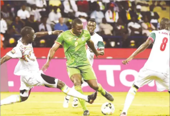  ??  ?? NO WAY THROUGH . . . Zimbabwe forward Nyasha Mushekwi’s effort is blocked by the Senegalese wall of Cheikhou Kouayate and Lamine Gassama in their 2017 Nations Cup Group B showdown at the Stade Francevill­e in Francevill­e last night.