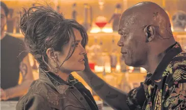  ??  ?? ACTION-PACKED: In the new action comedy ‘The Hitman’s Bodyguard’, Samuel L Jackson plays a mob killer who turns state’s evidence, with Salma Hayek as his less than thrilled wife.