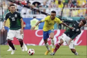  ?? AP PHOTO/ANDRE PENNER ?? Brazil’s Neymar, center, vies for the ball with Mexico’s Jonathan Dos Santos, right, and Mexico’s Hector Herrera, left, during the round of 16match between Brazil and Mexico at the 2018soccer World Cup in the Samara Arena, in Samara, Russia, Monday, July 2, 2018.