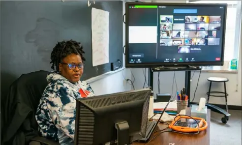  ?? Classroom on Thursday. Andrew Rush/Post-Gazette ?? Tanya Holyfield, a second grade teacher with Manchester Academic Charter School, teaches remote students from her