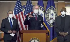  ?? J. scott APPLEWHITE / Ap ?? House ways and Means committee chairman Richard neal, D-mass., center, is flanked by Budget committee chairman John yarmuth, D-KY., left, and Majority whip James clyburn, D-s.c., at a news conference ahead of the vote on the Democrat's $1.9 trillion COVID-19 relief bill, at the capitol in washington tuesday.