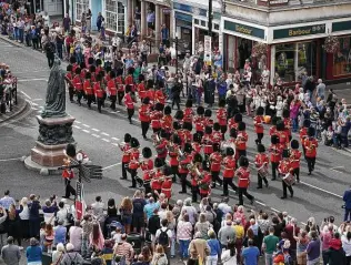  ?? Steve Parsons / Associated Press ?? Windsor Castle holds a special Changing of the Guard ceremony Saturday with “The Star-Spangled Banner” played to mark the 20th anniversar­y of the attack on the U.S.