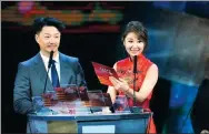  ??  ?? Above: Actress Ruby Lin and actor Duan Yihong announce the best actor award on the closing night of the festival. Right: Singers and dancers from SCO nations perform at the closing ceremony.